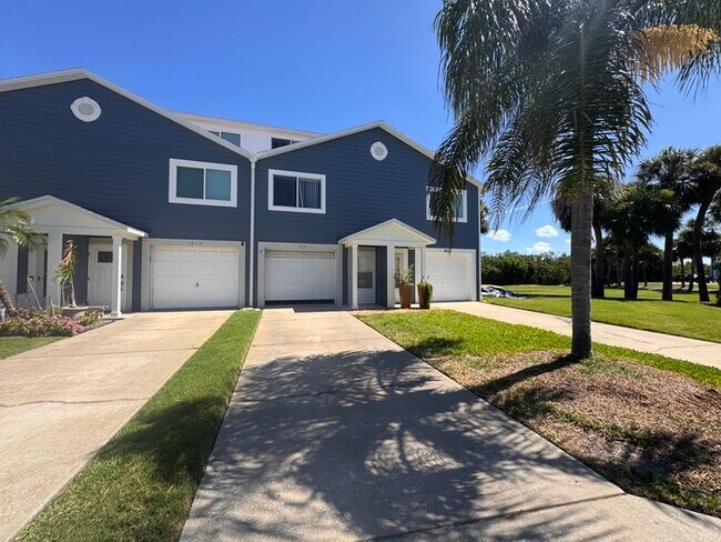 Building Photo - Coastal Luxury Awaits – 3-Story Townhome i...