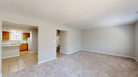 Located at 2910 White Knight Blvd, this two-story home offers a functional and practical layout across two floors, accommodating four bedrooms and four bathrooms. The main floor houses the living room, kitchen, and hallway connections, while the upper floor provides additional bedroom and bathroom space reached via a staircase.

The carpeted living room is generously sized, featuring neutral gray walls, a textured ceiling, and windows that invite natural light and outdoor views. The kitchen is well-appointed with warm honey-toned wood cabinetry, light marble-pattern countertops, a peninsula for additional prep or seating space, white appliances including an electric range and dishwasher, and tile flooring.

The four bedrooms are finished with plush carpet and neutral walls, maintaining a consistent, clean aesthetic throughout. Several bedrooms include closets with paneled doors, and windows provide natural light. The bathrooms feature wood-look vinyl plank flooring, warm wood vanities with marble-style countertops, and mirrored medicine cabinets, offering a cohesive design. Textured ceilings are present throughout the home, adding a consistent architectural detail. The overall ambiance is clean, neutral, and move-in ready.