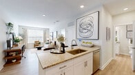 Located at 1330 Nashville Pike in Gallatin, TN, this well-designed one-bedroom, one-bathroom residence offers a thoughtful layout across a single floor. Light wood-style flooring runs throughout, creating a cohesive and clean aesthetic from room to room.

The open-concept kitchen and living area serves as the heart of the home. The kitchen features white shaker cabinetry, granite countertops, stainless steel appliances including a refrigerator, electric range, microwave, and dishwasher, and a peninsula with seating for three — ideal for casual dining or entertaining. Recessed lighting and crisp white walls keep the space feeling open and airy.

The living area offers generous natural light through large windows dressed with sheer curtains, creating a warm and inviting atmosphere well-suited for relaxing or working from home.

The bedroom is comfortably sized, bathed in natural light from dual windows, and equipped with a ceiling fan. A dedicated closet provides practical storage. The bathroom is finished with white subway tile surrounding the tub-shower combination, a granite-topped vanity with white cabinetry, and recessed lighting for a clean, polished look.

Throughout the residence, neutral tones and modern finishes create a calm, contemporary ambiance suited to a variety of lifestyles.