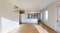This contemporary 990 square foot apartment in Salt Lake City offers a blend of style and functionality. The open-concept design seamlessly integrates the kitchen and living areas, creating a spacious feel. The kitchen boasts modern appliances, including a stainless steel refrigerator and built-in microwave, complemented by ample counter space and sleek cabinetry.

Two well-appointed bathrooms feature clean lines, with one showcasing a glass-enclosed shower. The apartment is flooded with natural light thanks to large windows that also provide stunning city views. Hardwood floors run throughout, adding warmth and elegance to the space.

Storage is plentiful with two closets, including a walk-in with built-in shelving. The living area is versatile, easily accommodating both relaxation and entertainment needs. Recessed lighting and a modern pendant fixture in the kitchen add to the apartment's contemporary ambiance.

Located at 440 West Silo Park Lane, this single-story residence combines urban convenience with modern comfort, making it an ideal home for those seeking a stylish city lifestyle.