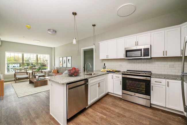 Virtually staged view of kitchen and main living area in 1 & 2 BR unit. - Lakeside of Cheshire