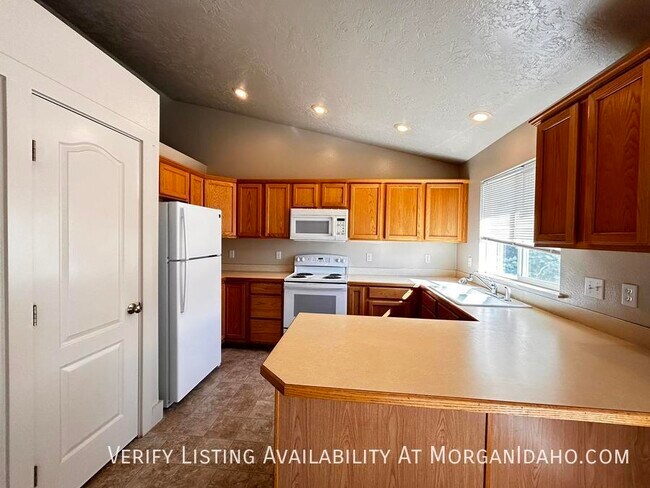 Building Photo - 2-car garage in convenient location w/ pat...