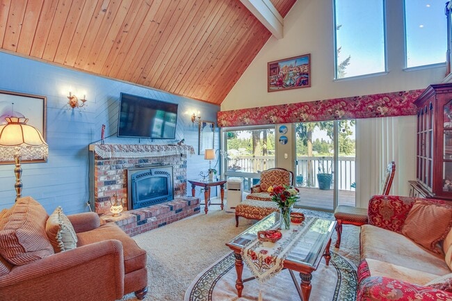 Main floor living room with a fire place - 26332 135th Ave SE