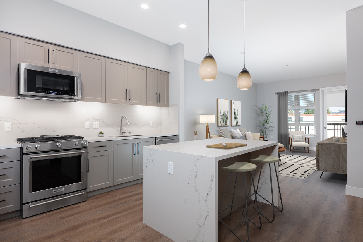 Signature Collection kitchen with upgraded stainless steel appliances, grey cabinetry, white marble countertops and backsplash, and hard surface flooring - Avalon Walnut Creek