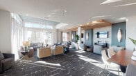 This sophisticated single-floor amenity lounge offers an expansive, open-concept layout designed for both relaxed gatherings and social interaction. The space is flooded with natural light through large floor-to-ceiling windows and clerestory glazing, offering sweeping panoramic views of the surrounding cityscape and beyond. Multiple distinct seating zones are arranged throughout, each furnished with contemporary sofas, armchairs, and coffee tables in neutral tones of grey, tan, and taupe, creating an inviting and cohesive aesthetic. A signature pendant chandelier with elongated glass drops anchors one of the seating areas beneath a recessed tray ceiling detail, adding a refined focal point to the room. The flooring features a boldly patterned dark carpet that contrasts elegantly with the bright white walls and ceilings. A dedicated wet bar area showcases sleek white cabinetry, a white quartz countertop, stainless steel appliances, and a striking three-dimensional textured tile backsplash in soft white. A built-in media wall with a large flat-screen television provides an entertainment-focused zone. The entry foyer is accented with circular mirror wall décor and ample natural light. Sculptural art pieces and lush indoor plants are thoughtfully placed throughout, enhancing the overall ambiance of this well-appointed communal space.
