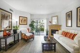 Located in Murrieta, CA, this well-appointed 2-bedroom, 1-bathroom single-floor residence offers an efficient and comfortable layout. The open-concept living and dining area is bright and welcoming, featuring wood-style flooring, a neutral color palette, and a classic fireplace with a decorative mantel as a focal point. A sliding glass door allows natural light to pour in while providing outdoor views, creating an airy ambiance throughout the shared living space.

The kitchen is thoughtfully equipped with light wood cabinetry, ample overhead storage, a gas range, built-in microwave, and a full-size refrigerator — offering everything needed for daily cooking. A dedicated dining area adjacent to the kitchen comfortably accommodates a full dining set.

The primary bedroom is a well-proportioned retreat featuring a window with views of the surrounding landscape, allowing natural light to fill the room. The second bedroom mirrors the clean, bright aesthetic found throughout the home. Both rooms are serviced by a full bathroom with wood-style flooring, a shower/tub combination, and light wood vanity cabinetry.

A private hallway connects the bedrooms, bathroom, and a dedicated closet space. A separate laundry area with side-by-side washer and dryer and overhead cabinetry adds exceptional convenience to this thoughtfully designed residence.