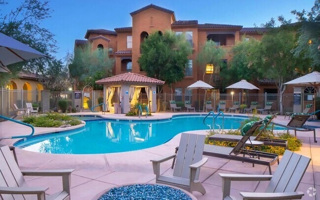 Relaxing Pool Deck with Lounge Chairs and Evening Ambiance - Desert Parks Vista