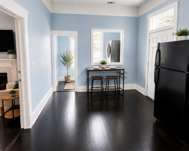 Fully equipped kitchen and dining area - 319 W 33rd St