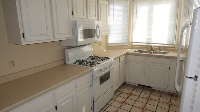 Gas range, over. New microwave. Tile floor. - 2317 Montana Ave E