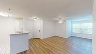 Located at 1700 Old England Loop in Sanford, FL, this single-story, 4-bedroom, 2-bathroom home offers a clean, move-in-ready layout designed for comfortable everyday living. Light-toned luxury vinyl plank flooring flows consistently throughout the main living areas and bedrooms, creating a bright and cohesive aesthetic. The open-concept living and dining area is spacious and airy, enhanced by ceiling fans and natural light from well-placed windows. A kitchen peninsula separates the cooking space from the living area, offering a casual bar-style counter for dining or prep work. The kitchen is outfitted with white cabinetry, a white refrigerator, electric range, and tile flooring, keeping the space clean and functional. Each of the four bedrooms is well-proportioned, with ceiling fans, ample natural light, and easy access to the hallways and closets distributed throughout the home. The primary bedroom provides a comfortable retreat with its generous footprint. Both bathrooms are finished in a crisp, white palette, with the full bath featuring a single-sink vanity with shaker-style cabinetry, a large mirror, and updated light fixtures. The home also includes a laundry area and a utility room, adding practical convenience to the thoughtfully organized floor plan.