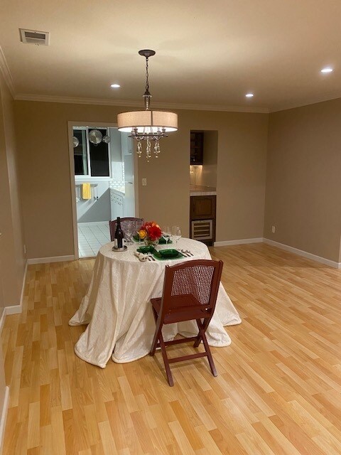 Dining room, dry bar w/ wine fridge in background - 4104 George Ave