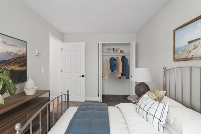 Welcome to Eagle Rock Apartments at Nashua, where modern comfort meets stylish living. This spacious bedroom offers a serene retreat with ample storage and contemporary design. Don’t miss your chance to elevate your lifestyle—schedule a tour today! - Eagle Rock Apartments at Nashua