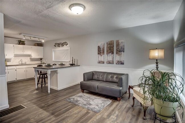 living room (foreground) and kitchen - 2745 Gladstone St