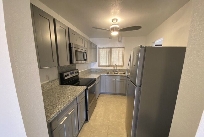 Building Photo - 2nd Floor Corner Townhouse at Waiau Garden...