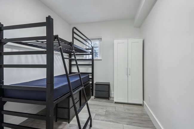 Bedroom with bunk bed and closet - 2500 Durant Avenue