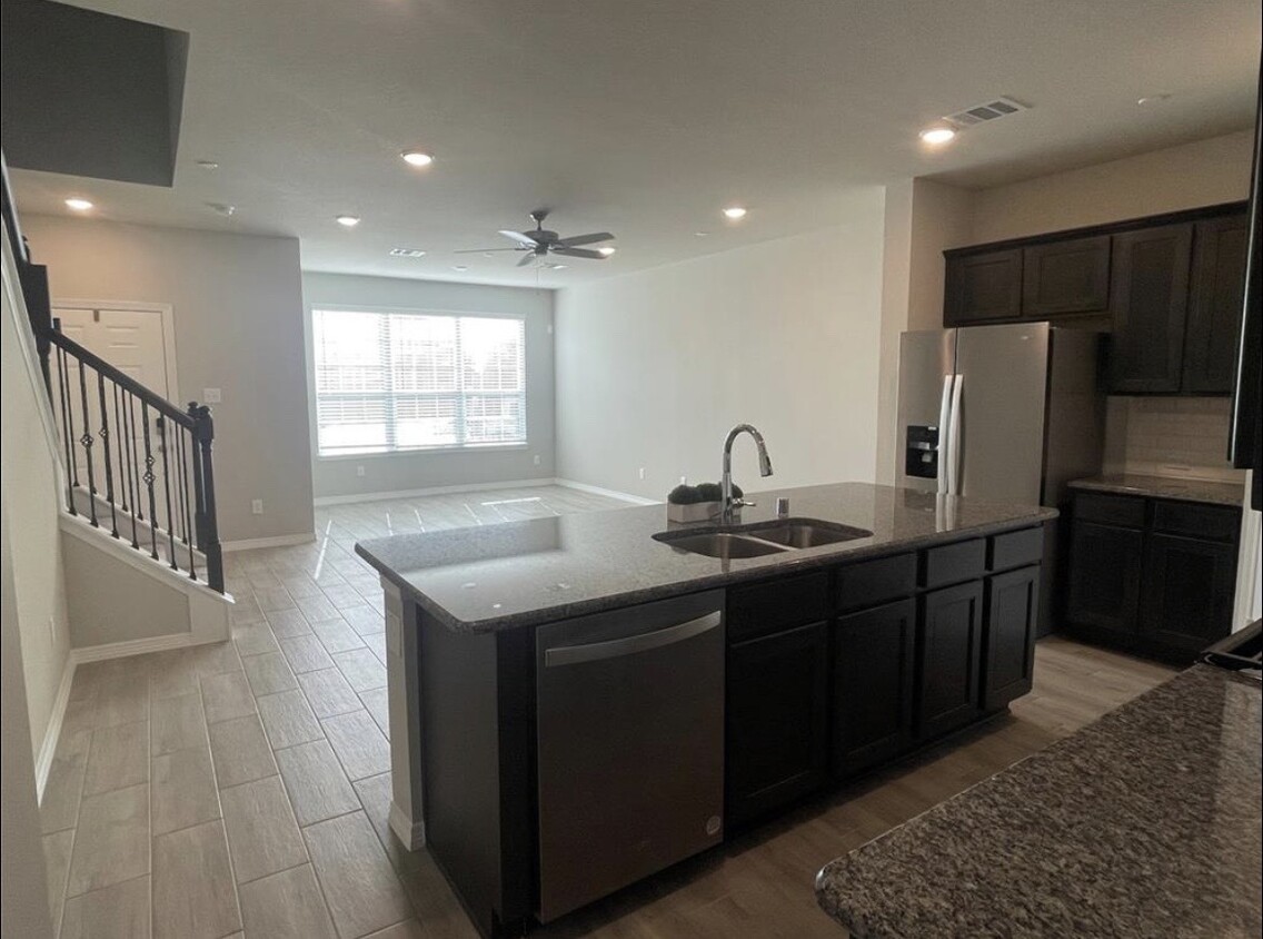 Open concept living room and kitchen - 8036 Scanlan Trl