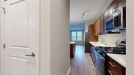 This 640 square foot apartment offers a thoughtful blend of comfort and functionality. The single-floor layout comprises one bedroom, one bathroom, and an open-concept living area. The primary bedroom, measuring 140 square feet, provides ample space and features carpeted flooring and large windows that allow natural light to flood in.

The kitchen is a standout feature, boasting rich wood cabinetry, stainless steel appliances, and a subway tile backsplash. The space is further enhanced by a central island with a white countertop, providing additional workspace and casual dining options. Modern pendant lighting adds a touch of elegance to the area.

The bathroom continues the contemporary aesthetic with a wooden vanity, white countertop, and large mirror. Tile flooring in the bathroom contrasts nicely with the wood-look flooring found throughout the main living areas, creating a cohesive yet varied design.

A notable feature is the walk-in closet, offering generous storage space with wire shelving. The apartment's neutral color palette, primarily in shades of beige and white, creates a bright and airy atmosphere throughout.

Located at 751 Vandenberg Road, this apartment effortlessly combines modern amenities with practical living, making it an ideal space for those seeking a compact yet stylish home.