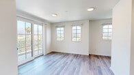 Located at 425 Garden St in the heart of Santa Barbara, CA, this thoughtfully designed 3-bedroom, 2-bathroom unit offers a clean, modern aesthetic across a single floor. Luxury vinyl plank flooring flows consistently throughout the home, complementing the crisp white walls and creating a bright, cohesive feel.

The kitchen is a standout feature, boasting sleek white flat-panel cabinetry extending to the ceiling, white quartz countertops, stainless steel appliances including a dishwasher, and recessed lighting. A large window floods the space with natural light and frames views of the surrounding neighborhood and palm trees.

The primary bedroom is a comfortable retreat featuring sliding glass doors that open directly onto a private balcony. From the balcony, residents enjoy sweeping views of Santa Barbara's iconic mountain backdrop and the lush tree-lined streets below. An additional window enhances natural light in the room.

The two additional bedrooms are well-proportioned, each featuring LVP flooring and windows that bring in natural light — one with a view of palm trees. Both include or adjoin closet space with sliding doors.

The two bathrooms maintain the home's clean design language, each featuring a white vanity with under-cabinet storage, a large mirror with overhead lighting, and LVP flooring. Hallways connect the rooms efficiently, completing this well-laid-out Santa Barbara residence.