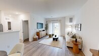 Located at 20 Franklin Ln in Manalapan, NJ, this thoughtfully designed one-bedroom, one-bathroom residence offers a comfortable and modern single-floor layout. The open-concept living and dining area is bathed in natural light from large windows and a sliding glass door, highlighting the smooth light wood-tone flooring that flows throughout the main living spaces. The living room provides generous room for relaxing and entertaining, with clean white walls that lend a bright, airy ambiance.

The kitchen features gray shaker-style cabinetry, crisp white countertops, a stainless steel appliance suite including a gas range, microwave, dishwasher, and refrigerator, and a functional galley-style layout that maximizes efficiency. A dedicated closet off the kitchen adds valuable storage.

The bedroom is a serene retreat, carpeted for comfort and filled with natural light from a large window with outdoor views. It includes access to a well-sized closet with built-in shelving, providing ample storage. The bathroom is finished with elegant marble-style tile flooring, gray vanity cabinetry, and a tub-shower combination, creating a clean and polished space. The overall design palette is neutral and cohesive, offering a calm, modern aesthetic throughout.
