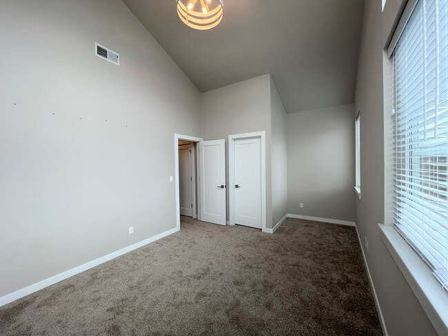 Front Bedroom with AMAZING Vaulted Ceilings and Two Story Windows - 12428 SW 171st Ter