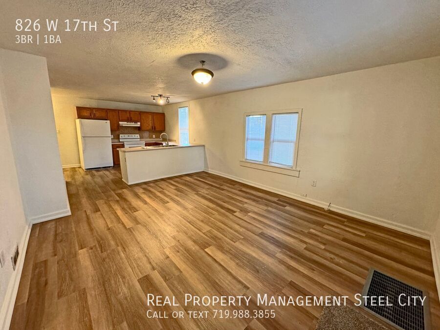 Primary Photo - Spacious 3-Bed Home with Garage & Fenced Y...