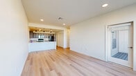 Located at 431 Picadilly Road in Aurora, CO, this single-floor, 2-bedroom, 2-bathroom residence offers a thoughtfully designed layout with a clean, modern aesthetic. Light-toned hardwood-style flooring flows consistently throughout the home, creating a bright and cohesive feel.

The heart of the home is an open-concept living, dining, and kitchen area. The kitchen is well-equipped with rich grey-toned cabinetry, granite countertops, a peninsula with pendant lighting, and black stainless appliances including a range and microwave. Ample louvered pantry and utility closet doors provide generous storage adjacent to the kitchen. The living area benefits from large windows that draw in abundant natural light.

Both bedrooms are comfortably sized, with the primary bedroom offering a spacious walk-in closet featuring wire shelving for organized storage. The second bedroom includes a sliding-door closet and a ceiling fan, with windows overlooking the exterior. A combined bathroom and laundry room adds practical convenience, while a second full bathroom features granite-topped vanity cabinetry. A utility room and hallway complete the efficient floor plan, making this Aurora residence a functional and attractive home.