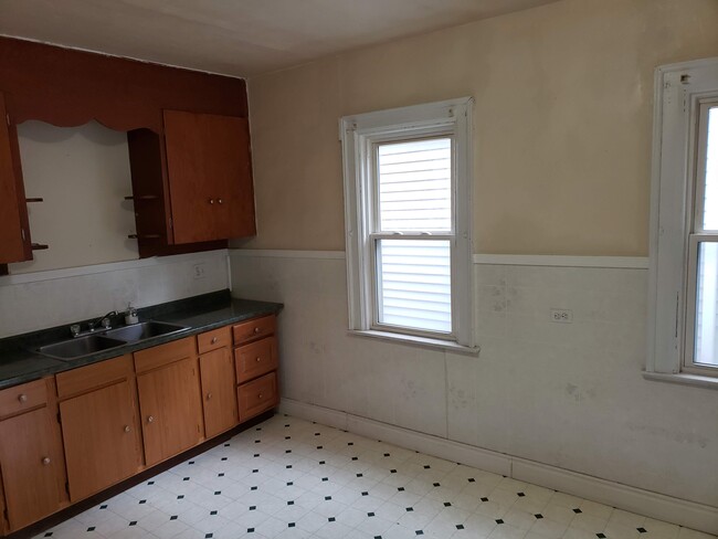 10 foot ceilings and two windows in the kitchen give it a open atmosphere to prepare meals. - 392 Marilla Street