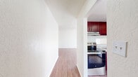 This well-designed apartment in Summit West offers 1070 square feet of living space on a single floor. The layout comprises three bedrooms, including a primary bedroom of 170 square feet, two full bathrooms, a kitchen, and additional living areas. Throughout the apartment, warm-toned hardwood flooring creates a cohesive and inviting ambiance.

The modern kitchen is a standout feature, boasting rich, cherry-wood cabinetry, sleek stainless steel appliances, and light-colored countertops. The space is well-equipped for culinary enthusiasts, with ample storage and preparation areas.

The bedrooms are generously sized, with the primary bedroom offering 170 square feet of space. Each bedroom features built-in closets for storage convenience. The bathrooms are fitted with modern fixtures, including vanities that complement the overall design aesthetic.

Large windows in the living areas and bedrooms allow for plentiful natural light, creating a bright and airy atmosphere. The main living space is open and flexible, ideal for various furniture arrangements and entertaining guests.

The apartment's neutral color palette, predominantly in whites and warm wood tones, provides a blank canvas for personal decorating styles. With its thoughtful layout and modern amenities, this Summit West apartment offers a comfortable and stylish living environment.