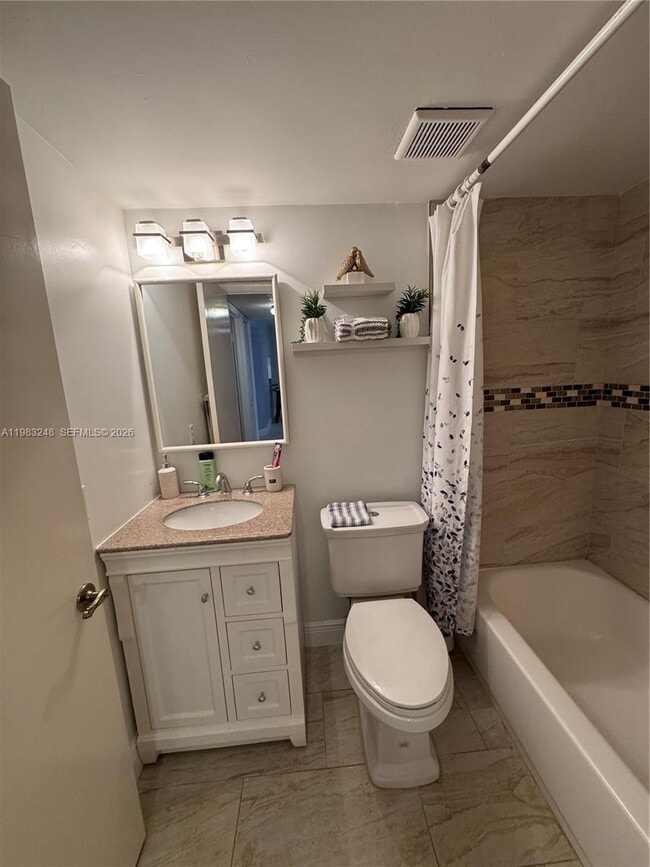 Building Photo - 6095 N Sabal Palm Blvd