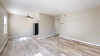 Located at 5011 Southside Dr in Louisville, KY, this well-appointed 1-bedroom, 1-bathroom unit offers a practical and comfortable layout across a single floor. The open living area is finished with light wood-look flooring that extends throughout the main spaces, complemented by neutral beige walls and a ceiling fan that adds both function and style. Natural light filters in through well-placed windows, enhancing the bright, airy feel of the living space.

The galley-style kitchen is efficiently designed, featuring dark lower and upper cabinetry, light marble-look countertops, a stainless steel double-basin sink, and white appliances including a range and dishwasher. A ceiling vent ensures proper ventilation throughout.

The generously sized bedroom offers plush wall-to-wall carpeting, a natural light source via a window with blinds, and a large built-in closet with bi-fold doors — providing ample storage. The neutral tones throughout create a calm, cohesive atmosphere.

The bathroom includes a full tub/shower combination with clean white surround and updated fixtures, finished with wood-look flooring that ties the space together. This unit delivers a clean, move-in-ready living experience with functional design throughout.