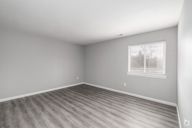 2BR, 1BA - 910SF - Primary Bedroom - Lansing Grove Apartments