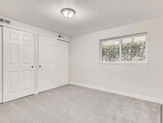 Building Photo - 7110 E 63rd Ave