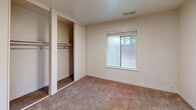 Located at 280 Oak Ave in Galt, CA, this single-floor, one-bedroom, one-bathroom unit offers a thoughtfully arranged layout ideal for comfortable everyday living. The living room is bright and welcoming, featuring wood-look hard flooring and a full-width sliding glass door that opens to a private, fenced outdoor patio area, allowing abundant natural light and easy outdoor access. Adjacent to the living room, the dining area provides a seamless transition between the main living and kitchen spaces. The kitchen is well-equipped with white cabinetry offering ample storage, dark speckled countertops, a double-basin stainless steel sink with a modern faucet, a white range with overhead ventilation, and wood-look flooring that ties the space together. A natural light source from a window adds brightness to the kitchen. The bedroom is carpeted for warmth and comfort, featuring a sliding closet with hanging rods, a second dedicated closet, and a window that brings in natural light. The bathroom includes a granite-style vanity countertop, a combined tub and shower with grab bars, and wood-look flooring. A hallway connects the main areas efficiently, completing this well-organized and functional single-story home.