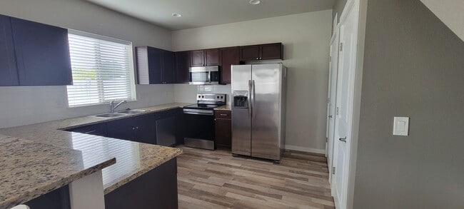 Building Photo - "Luxury Living: Stunning End Unit Townhome...
