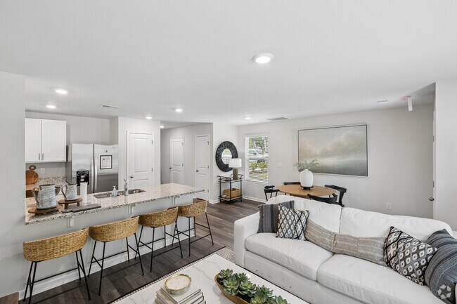 Pearson - Modelo - 3 habitaciones, 2.5 baños - 1418 pies cuadrados - Sala de estar - The Townes at Amber Bluff