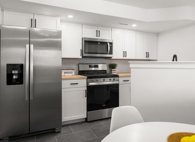 Kitchen - stainless steel appliances & gas range stove - 555 N 75 W
