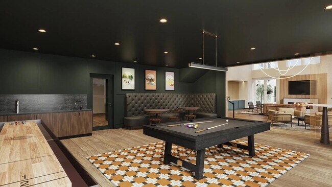 Sala de juegos con billar, tejo y mesas de juego en los apartamentos Modera Shoreline en Shoreline, WA. - Modera Shoreline