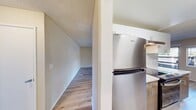 This contemporary apartment in Birch Creek - Unit 29, Mountain View, offers 910 square feet of efficiently designed living space. The interior showcases a recent renovation with a modern aesthetic throughout. The sleek kitchen features a galley layout with contrasting white upper cabinets and wood-toned lower cabinets, complemented by stainless steel appliances and quartz countertops. Light wood-look flooring flows seamlessly through all rooms, enhancing the sense of space and continuity.

The two bedrooms are generously sized, with the primary bedroom measuring 160 square feet. Both bathrooms have been updated with modern fixtures, including a combination tub-shower in one and a stand-alone shower in the other. Large windows in the bedrooms and living areas allow ample natural light, creating a bright and airy atmosphere.

The open-concept living and dining area provides a versatile space for relaxation and entertainment, with sliding glass doors leading to an outdoor patio. This outdoor connection extends the living space and offers a private area for fresh air and leisure activities.

Storage solutions are integrated throughout, with built-in closets in the bedrooms and additional cabinetry in the common areas. The apartment's single-floor layout ensures easy accessibility and efficient use of space. Located in the desirable Mountain View area, this unit combines modern comforts with a prime location, making it an attractive option for those seeking a contemporary living experience in Silicon Valley.