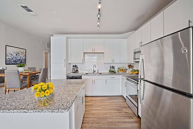 Experience the joy of cooking in your bright and spacious kitchen. - Windsor Republic Place