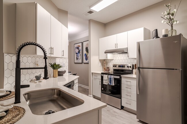 Newly Renovated Kitchen with Stainless Steel Appliances - The Residences on McGinnis Ferry Apartments