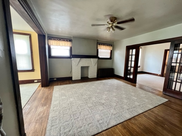 View of living room. Sunroom to left, dining room to right - 180 Noble Ave