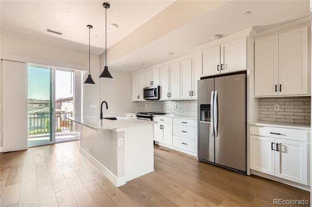 Building Photo - 1565 W 67th Ave