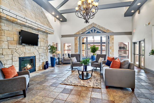 Clubhouse fireplace - Grand Centennial Apartments