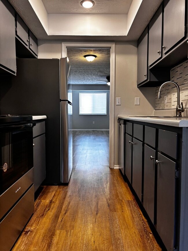 Building Photo - Charming 2-Bed, 1.5-Bath Condo with Carpor...