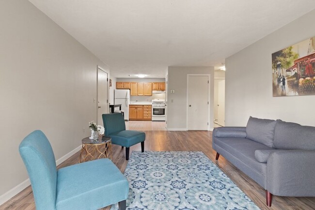 Living room and kitchen, new flooring, baseboard, and paint - 9 Kenmar Dr