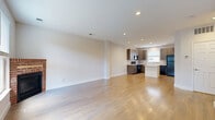 Located at 2758 Iowa Dr in Fort Collins, Colorado, this three-bedroom, two-bathroom home spans three well-proportioned floors, offering a functional and comfortable layout. The ground level features a spacious attached garage with ample storage and direct interior access, along with a utility area. The main living floor showcases gleaming hardwood floors throughout the open-concept living room and kitchen. The living room is bright and welcoming, anchored by a classic brick fireplace and large windows that invite abundant natural light. The modern kitchen is appointed with dark wood cabinetry, a tile mosaic backsplash, light quartz countertops, black appliances, and a central island—ideal for both cooking and casual dining. A convenient half-bath is also located on this floor. The upper floor is dedicated to the three bedrooms, each carpeted for comfort and equipped with ceiling fans. The spacious primary bedroom includes a walk-in closet, while the secondary bedrooms feature built-in closets with panel doors. The full bathroom on this level offers a clean, white tub-shower combination with tile flooring. Clean lines, neutral tones, and recessed lighting throughout give the home a fresh, move-in-ready feel.