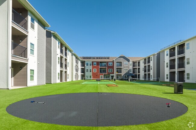 Outdoor Courtyard with a Putting Green, Pickle Ball, and Shuffle Board - Park Residences Plano Properties