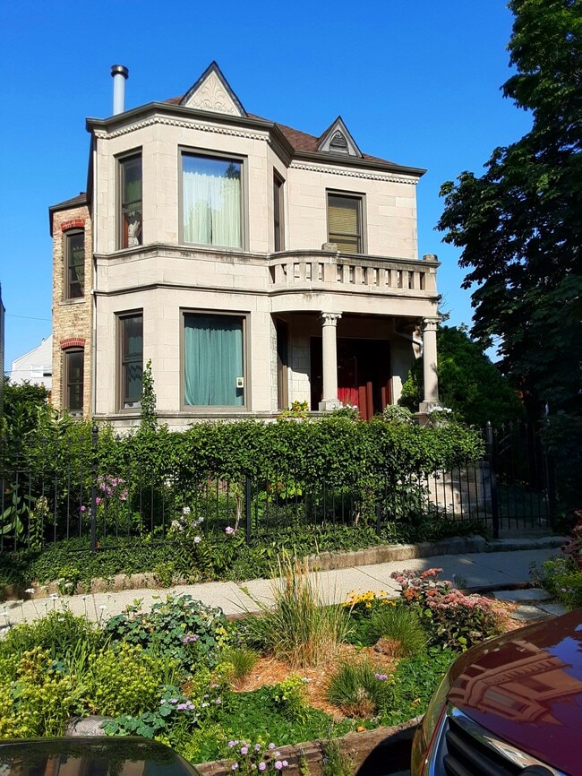 Classic Chicago Greystone circa 1905 on a fully fenced double lot. - 2422 N Drake Ave