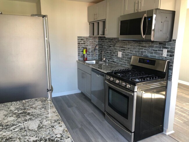 Building Photo - Twin Brick Home in Ridley SD! Granite and stainless kitchen! Renovated bathroom! Large rear fence...
