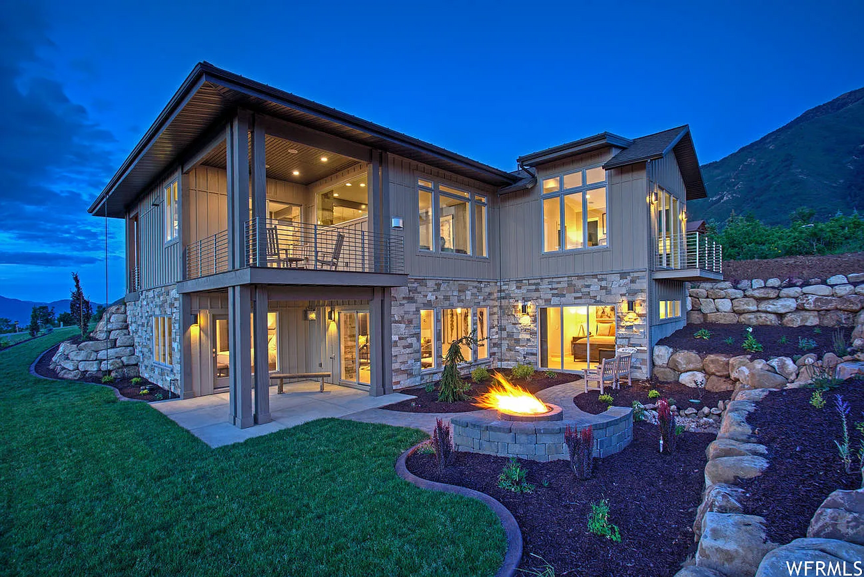 Back of house with deck, firepit & waterfall - 732 S Nebo Cir